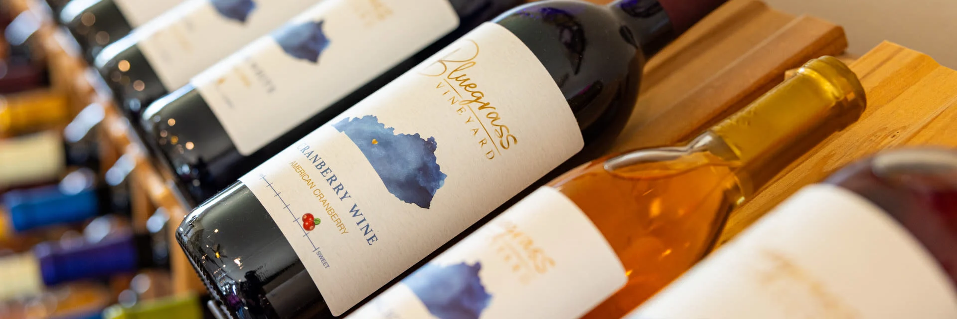 Bluegrass Vineyard Wines on a rack in the tasting room