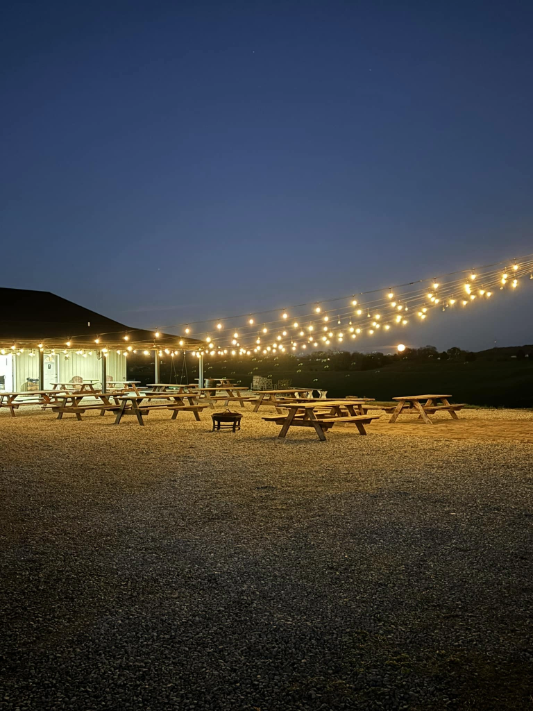 Outdoor seating at night with lights at Bluegrass Vineyard in Smiths Grove Kentucky